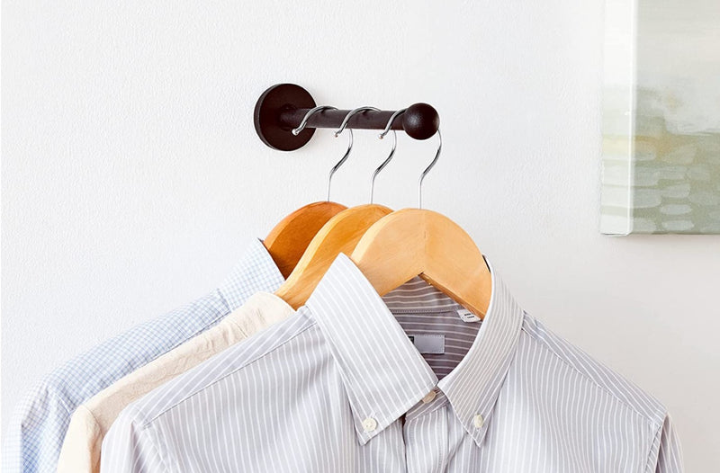 Pullout garment rod holding three shirts on hangars